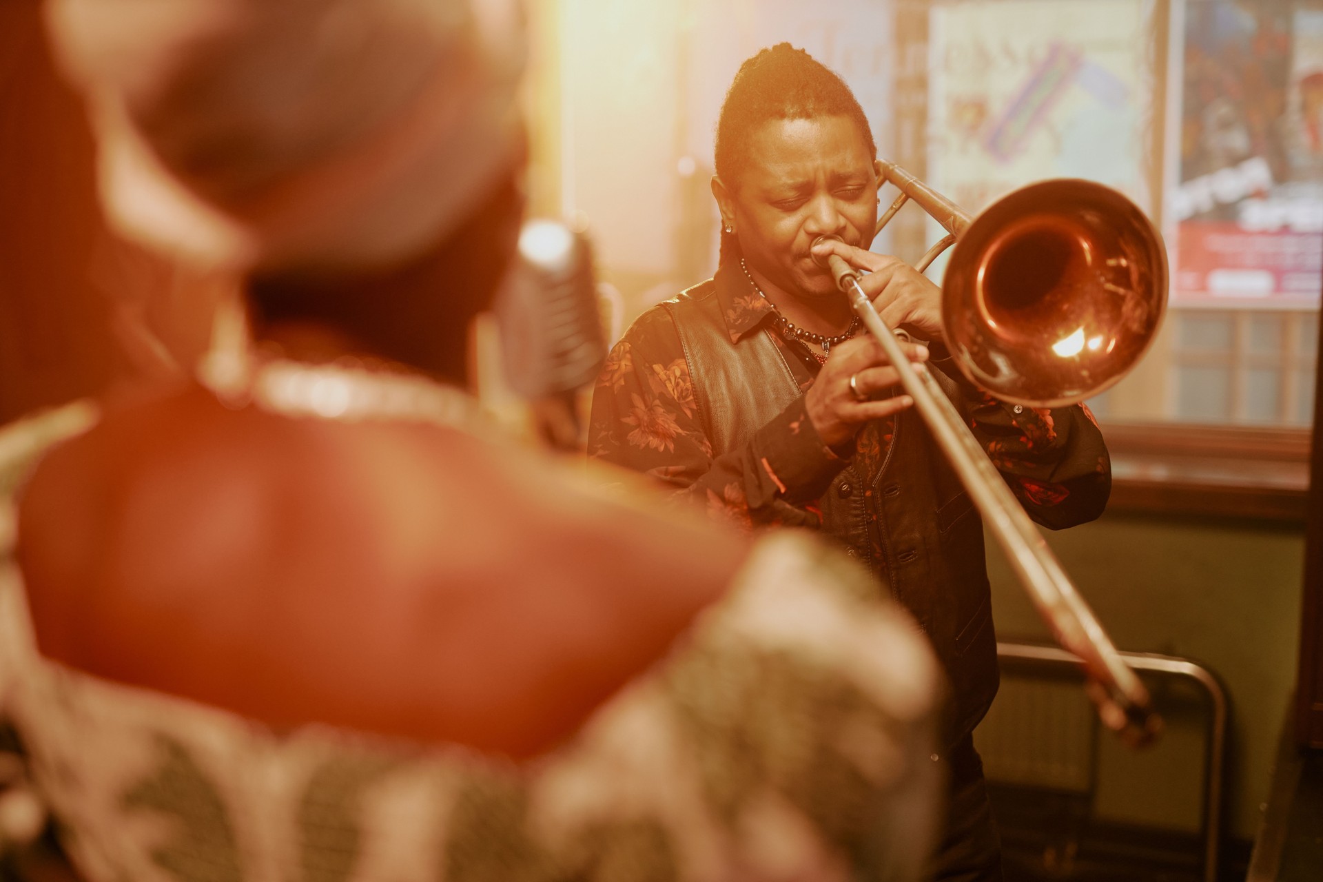 Man Playing Trombone On Stage With Jazz Band
